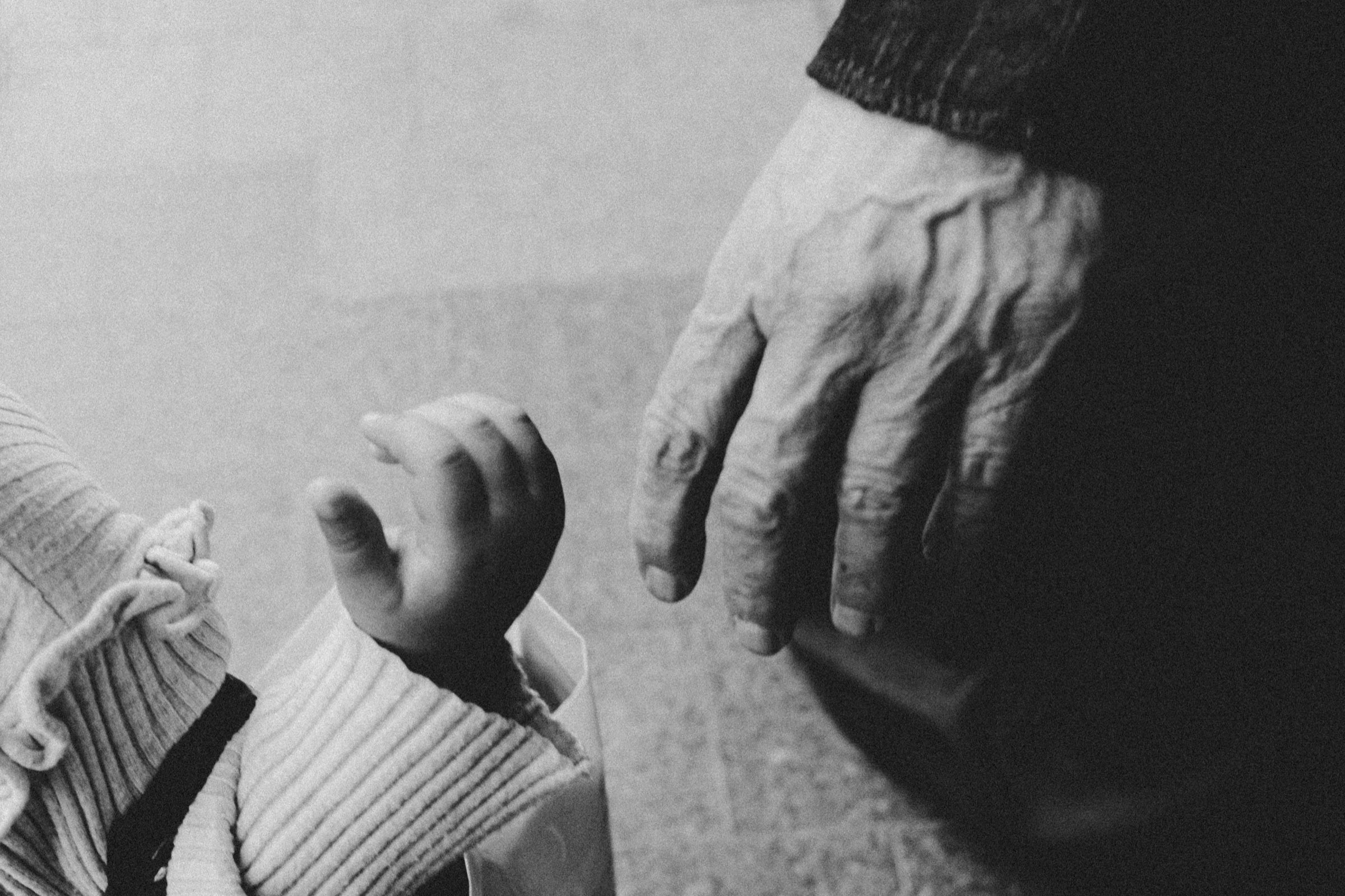 Holding a child's hand, Sidon — Colored Air