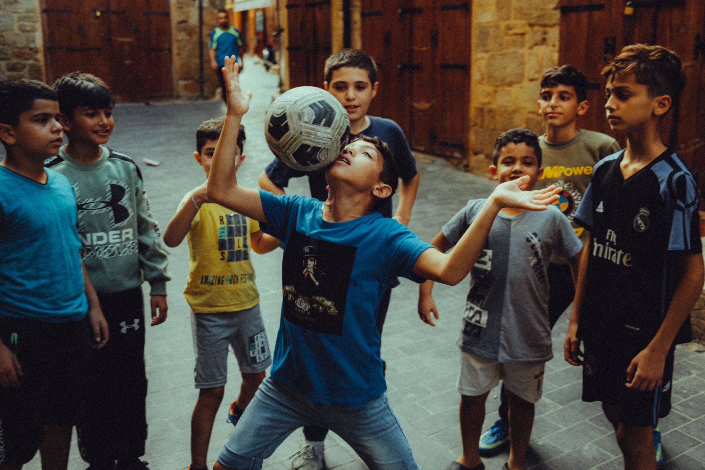 Kids playing football in Ancient Sidon — Colored Air