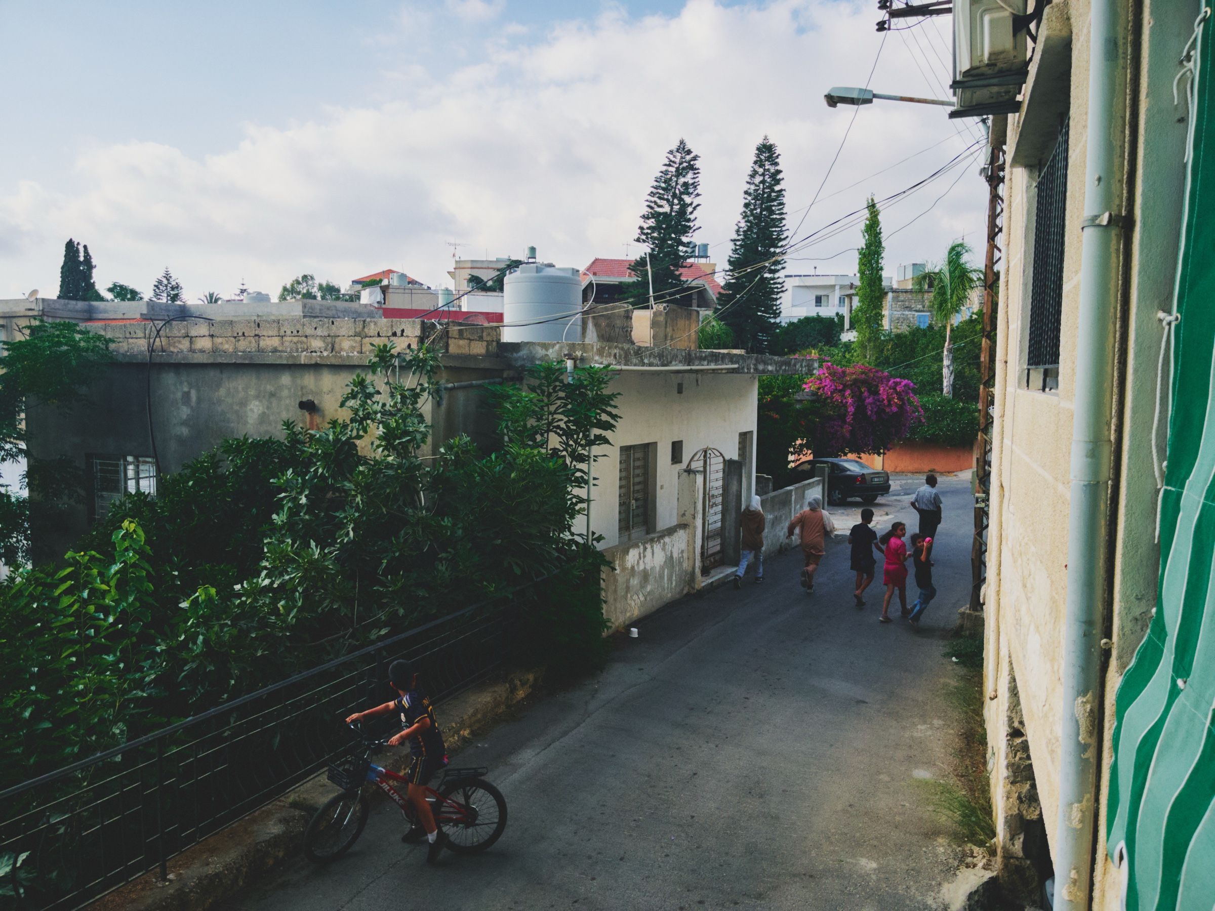 Kids running and playing in one of Joun’s old neighborhoods. The town of Joun, Lebanon, 2025.